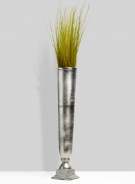 raw nickel trumpet vase with grass