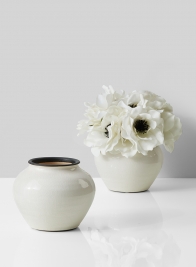glazed white ceramic fishbowl vase with anemones
