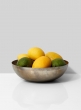 lemons limes in metal fruit bowl
